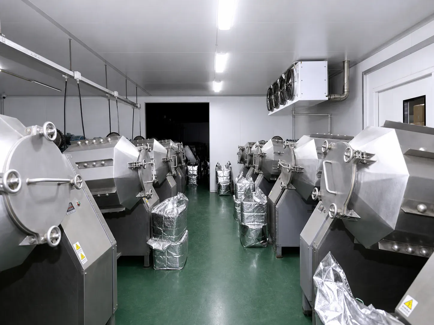 Rows of ball-milling equipment in an owned facility