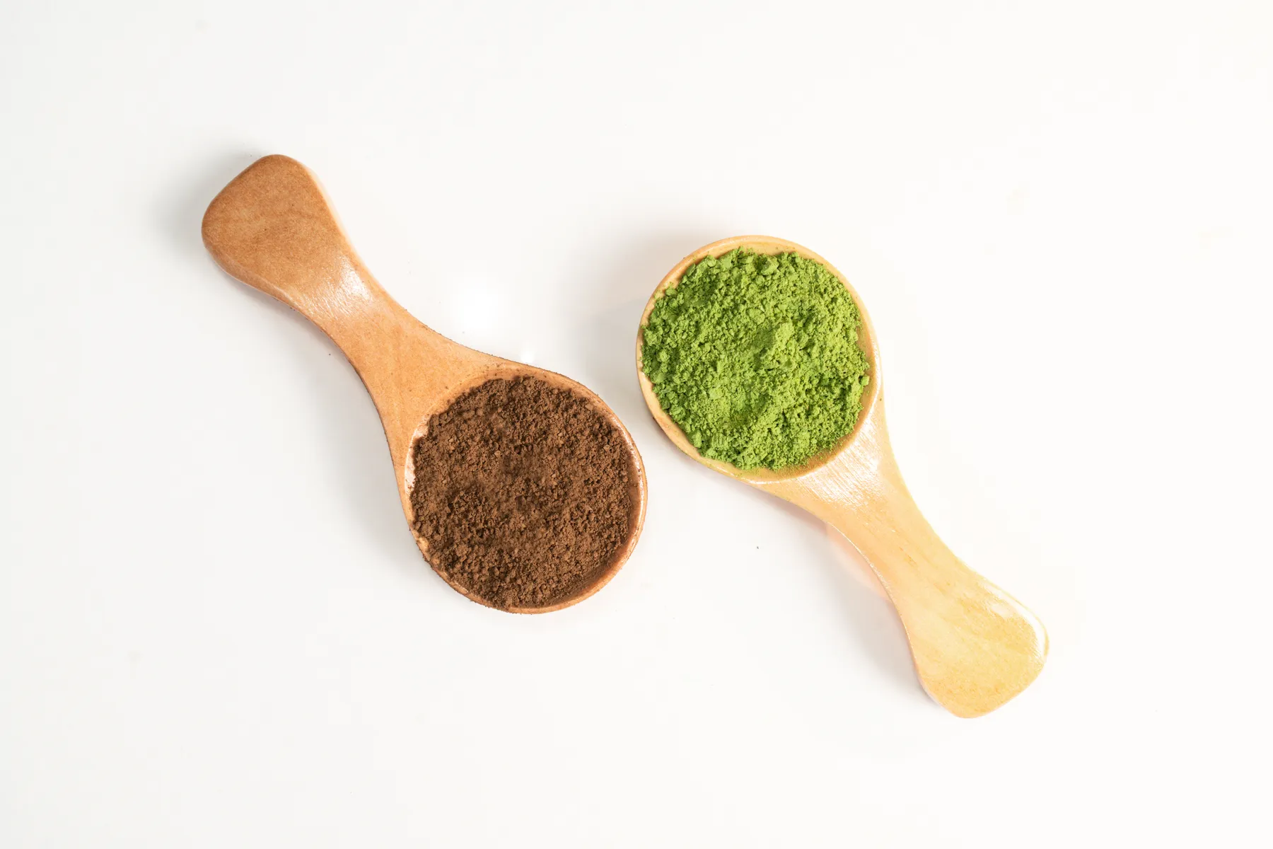 Matcha powder in a wooden spoon